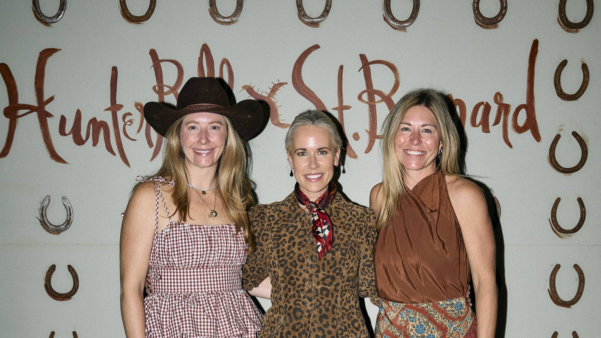 Courtney Ross, Hunter Bell and Ashleigh Goyer in front of the Hunter Bell x Saint Bernard horseshoe wall at Round Top Dance Hall