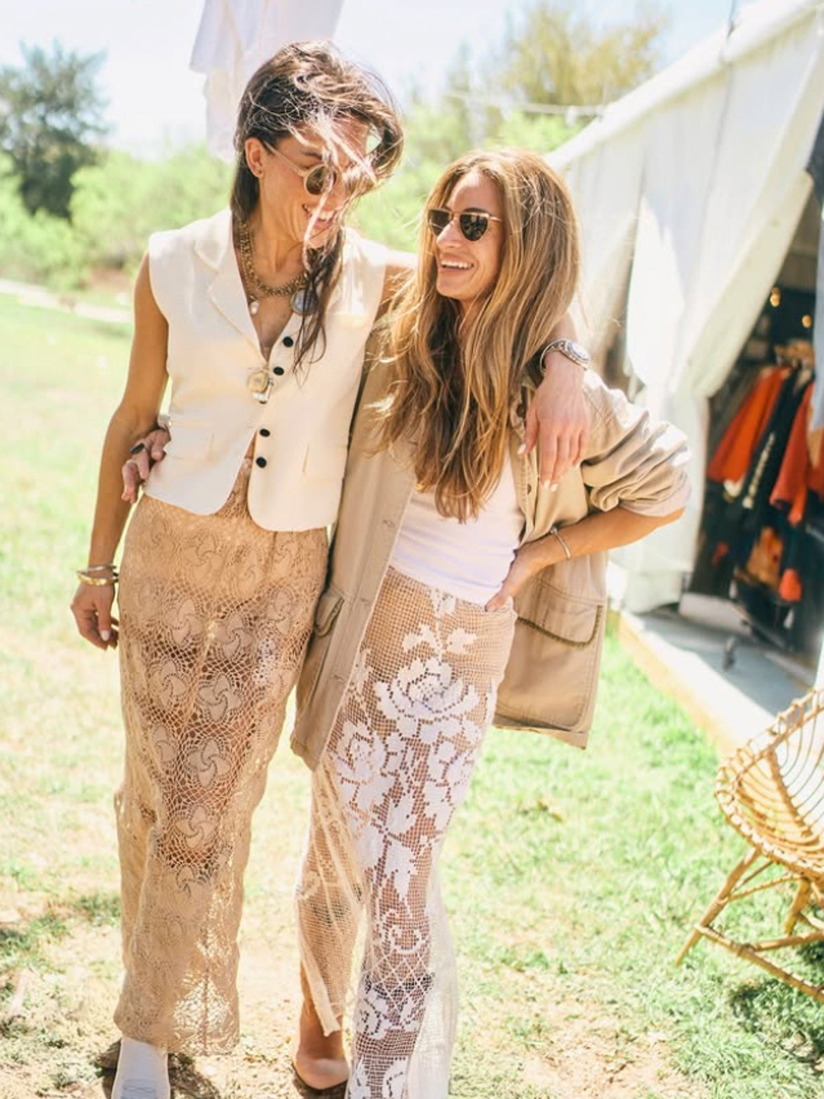 Natalie Lindsey and a friend walking together at the Round Top antiques show wearing vintage-inspired outfits