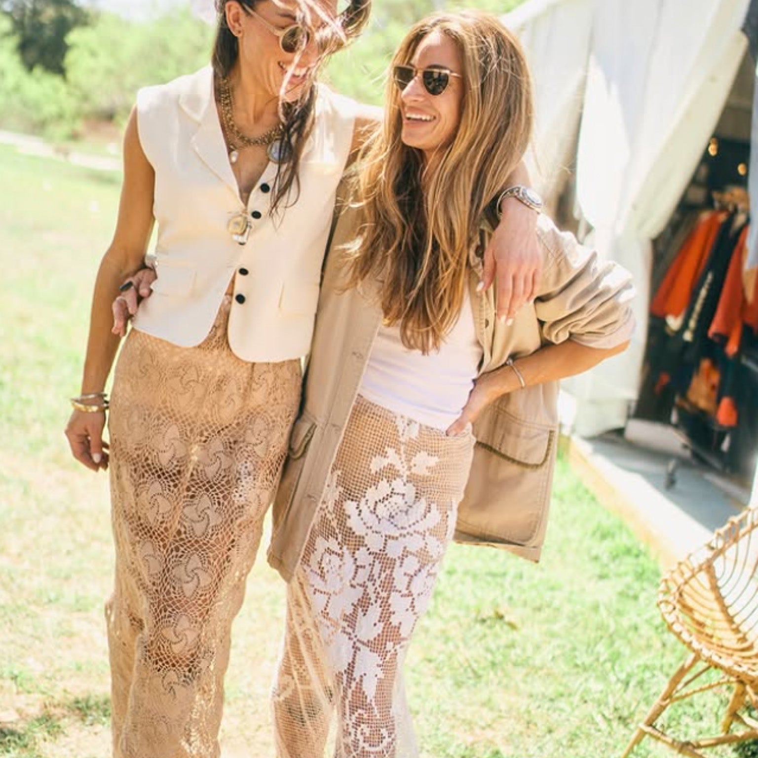 Natalie Lindsey and a friend walking together at the Round Top antiques show wearing vintage-inspired outfits